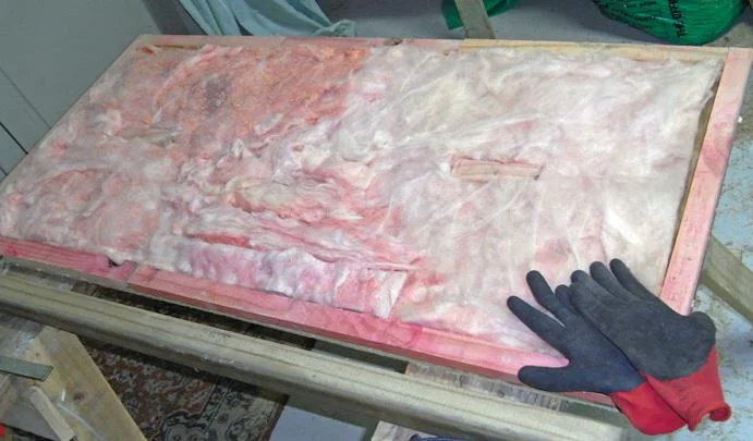 Insulation sandwiched between inner and outer walls