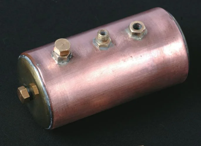From left, boiler holes for level check (in end), filling, steam outlet, safety valve.