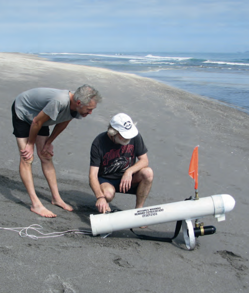 Steve Jeffares with friend Paul about to launch the kontiki. Phone numbers are for “lost and found” calls if the machine strays.