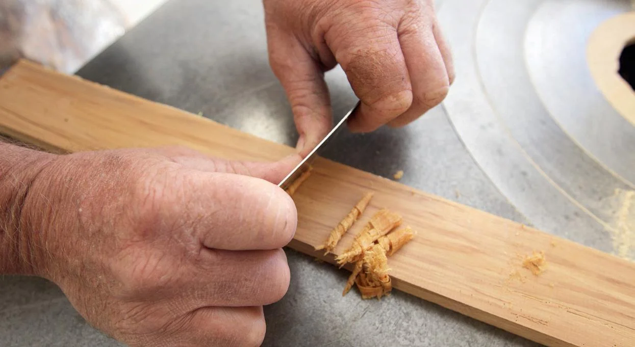 Using the scraper – better than sandpaper.