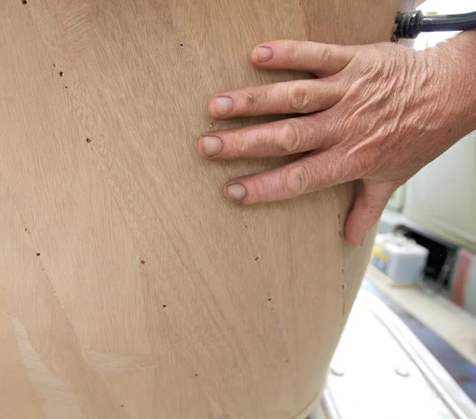 Where the body curves, the ply has been fitted in strips that are twisted on an angle to stop the edges protruding.