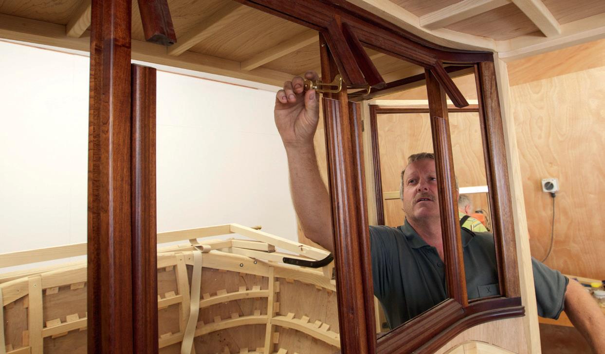 Neil shows hand-made latches for the vent windows between the driver and passengers.