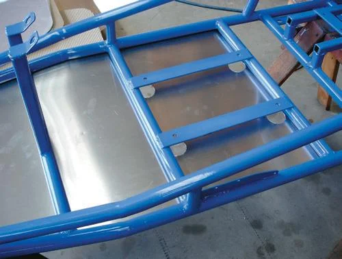 Base pan in place. Note the access holes for the seat bolts.