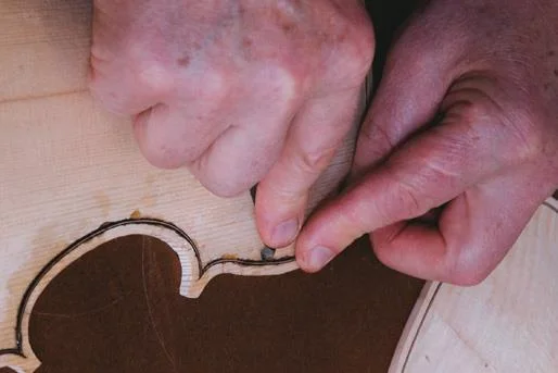 Purfling pick pushes inlay down.