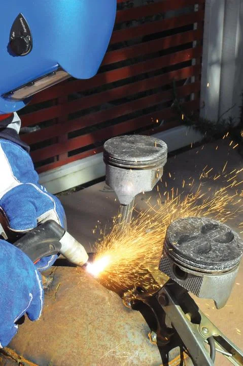 Angle of plasma torch piercing domed end prevents slag coming back onto tip.