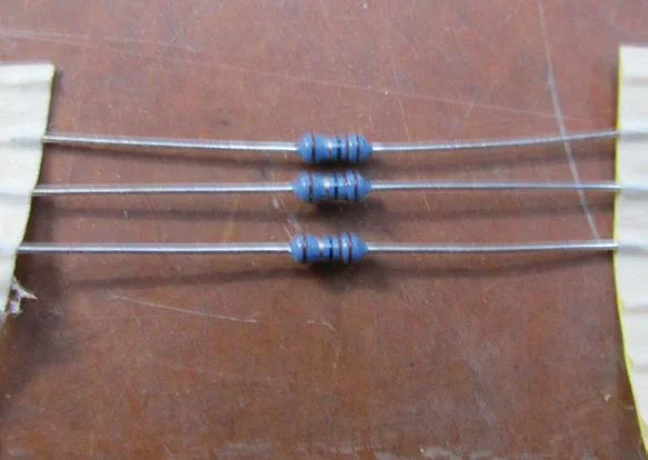 Three normal resistors. Resistors of less than 100 ohms will just melt.
