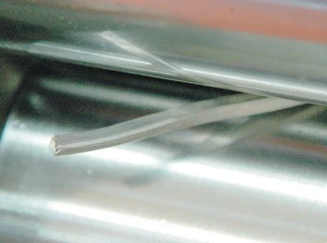 Milling silver rod in flat rollers.