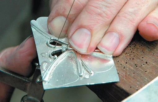 Cut away silver sheet.