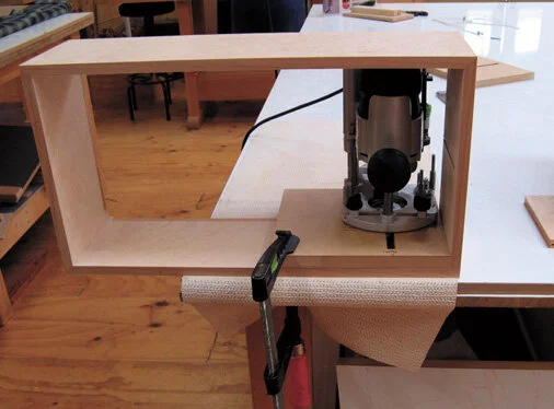 Cutting grooves for the shelves.