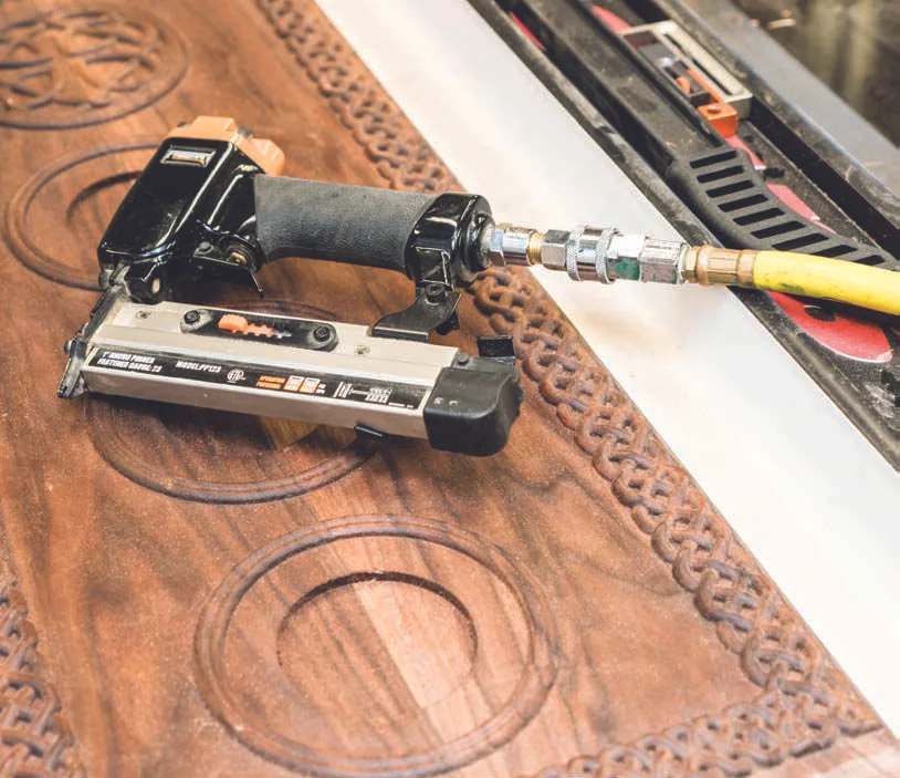 Gluing and tacking the MDF backing to the panel.