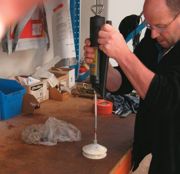 Use a bearing grease-packer