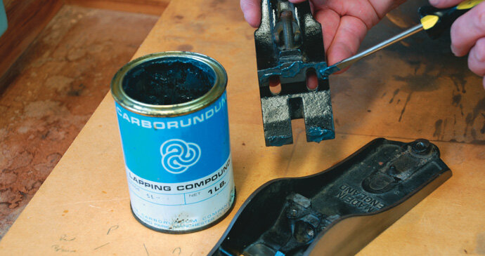 Applying lapping paste to seat the frog onto the base