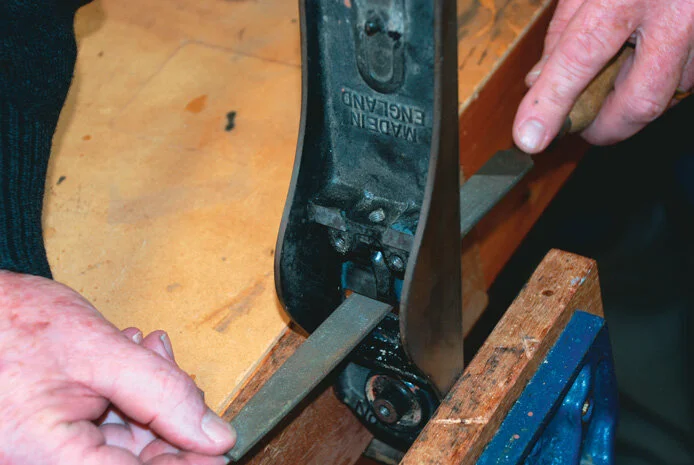 Filing the throat to remove any burrs ensuring a smooth entry for any shavings
