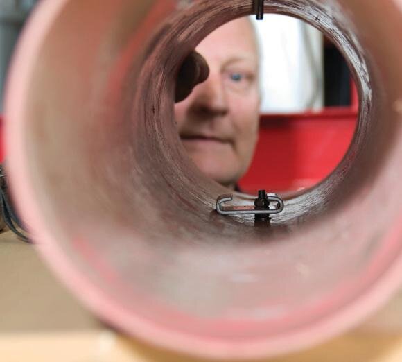 Bayonet holds batteries offset in tube