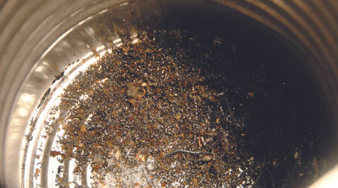 The collected swarf in the coffee tin.