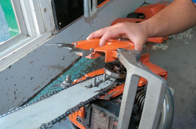 Removing the chain brake cover