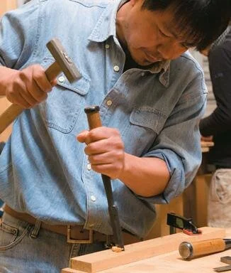 Ryo Magami with a struck Japanese chisel.