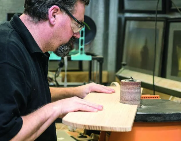 Smoothing the wing profile on the disc sander…