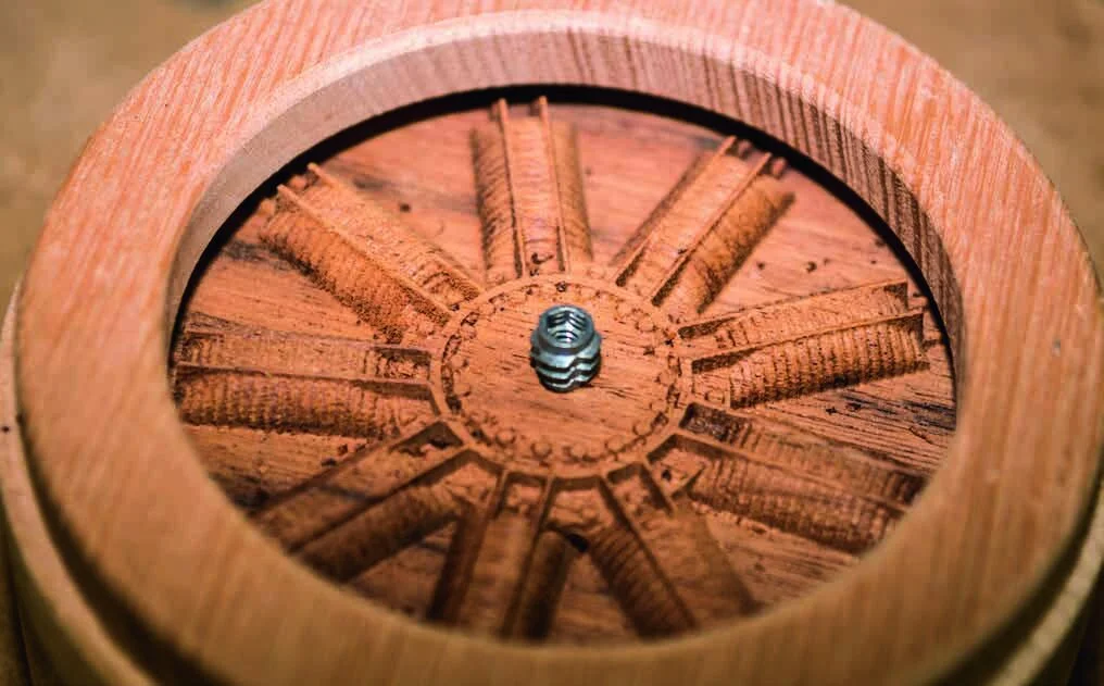 The threaded insert screwed into the front of the engine