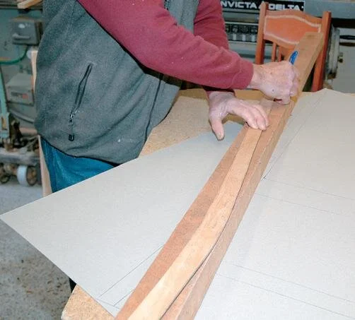 Marking out the rear leg shape from the template