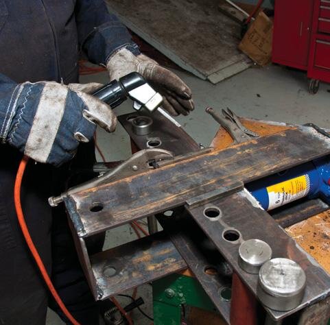 Preparing to weld 10mm square bar guides to side of ﬁxed frame