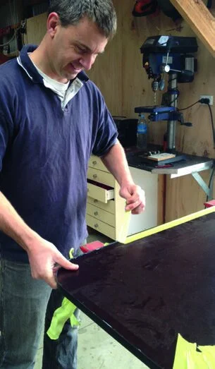 Tape holds PVC edging while glue dries