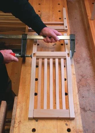 Gluing and clamping the chair back.