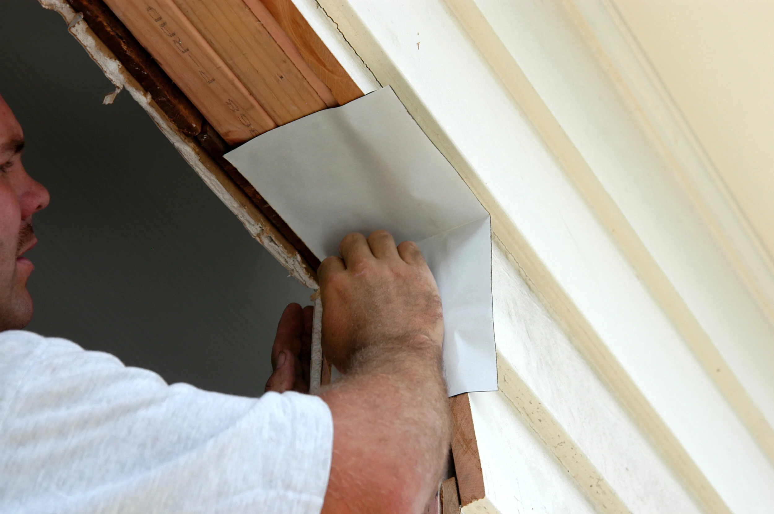 Sill tape around top corners