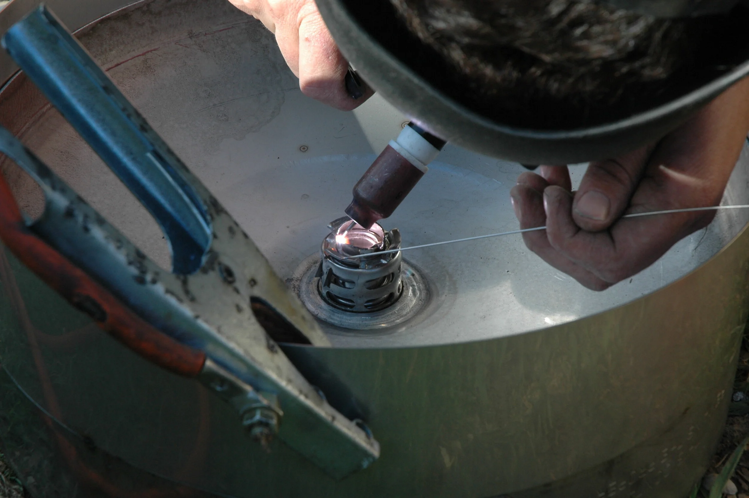 Welding the valve spring in place