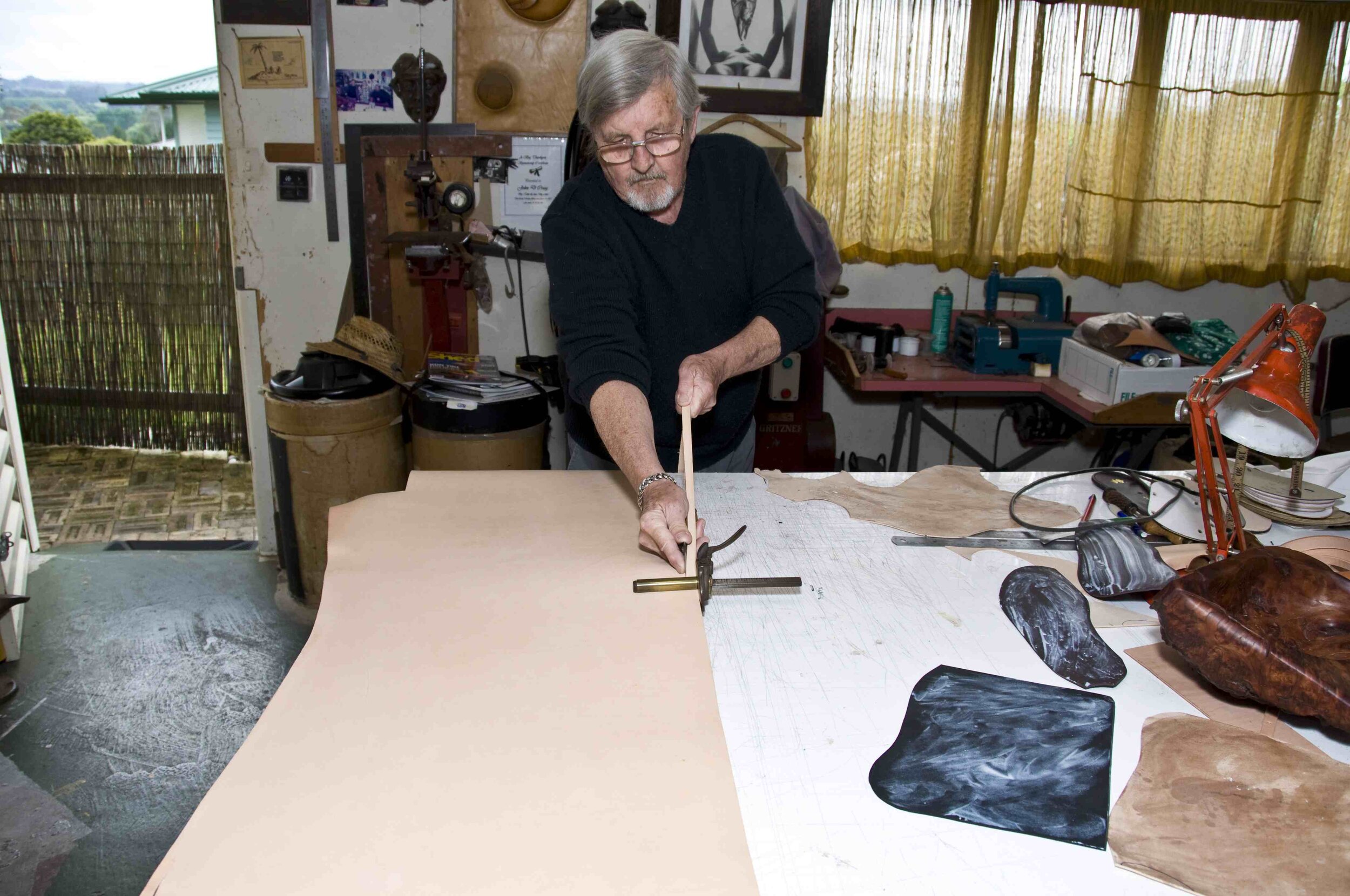 Strap cutter cuts the cross-straps and plaited straps