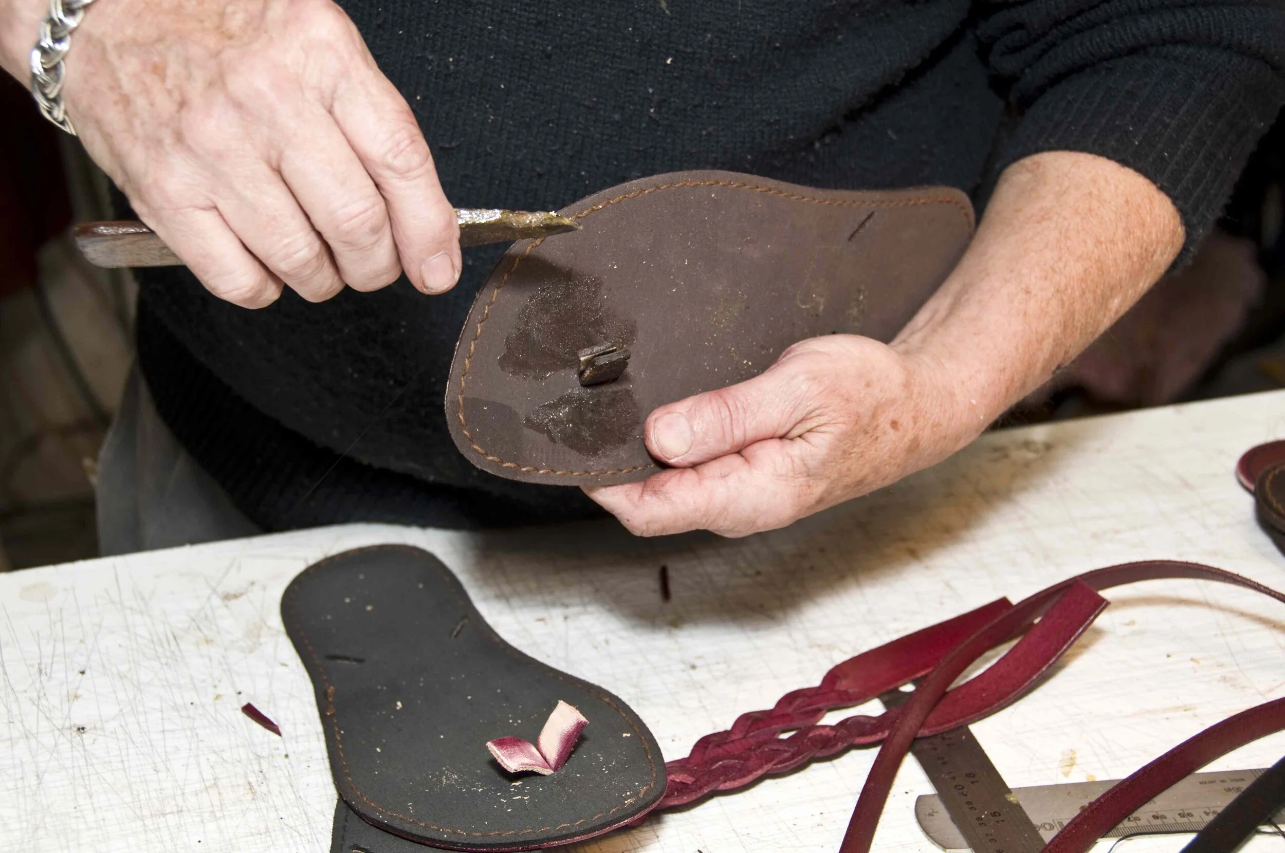Fitting the toe end of the jandals. Note the ends of the straps have been roughened