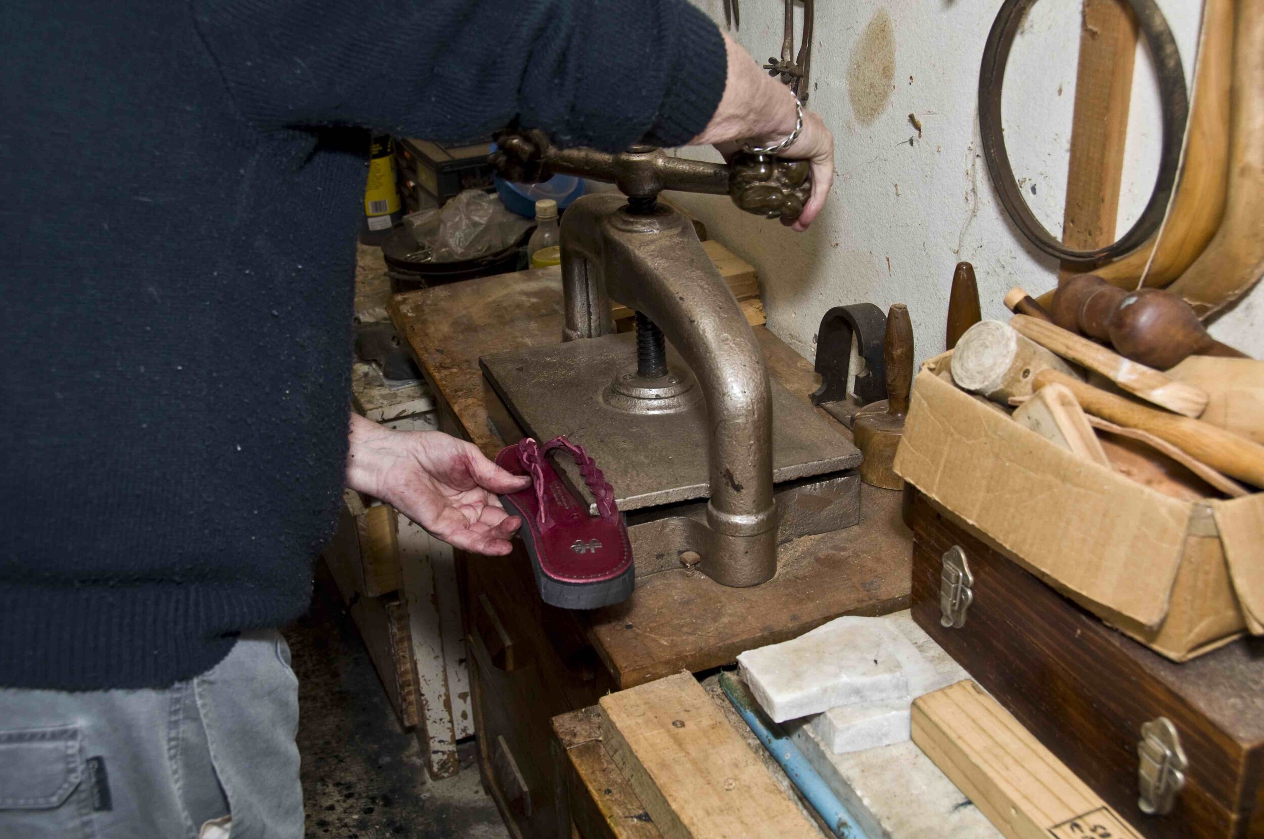 Pressing. You can also use a vice with soft jaws