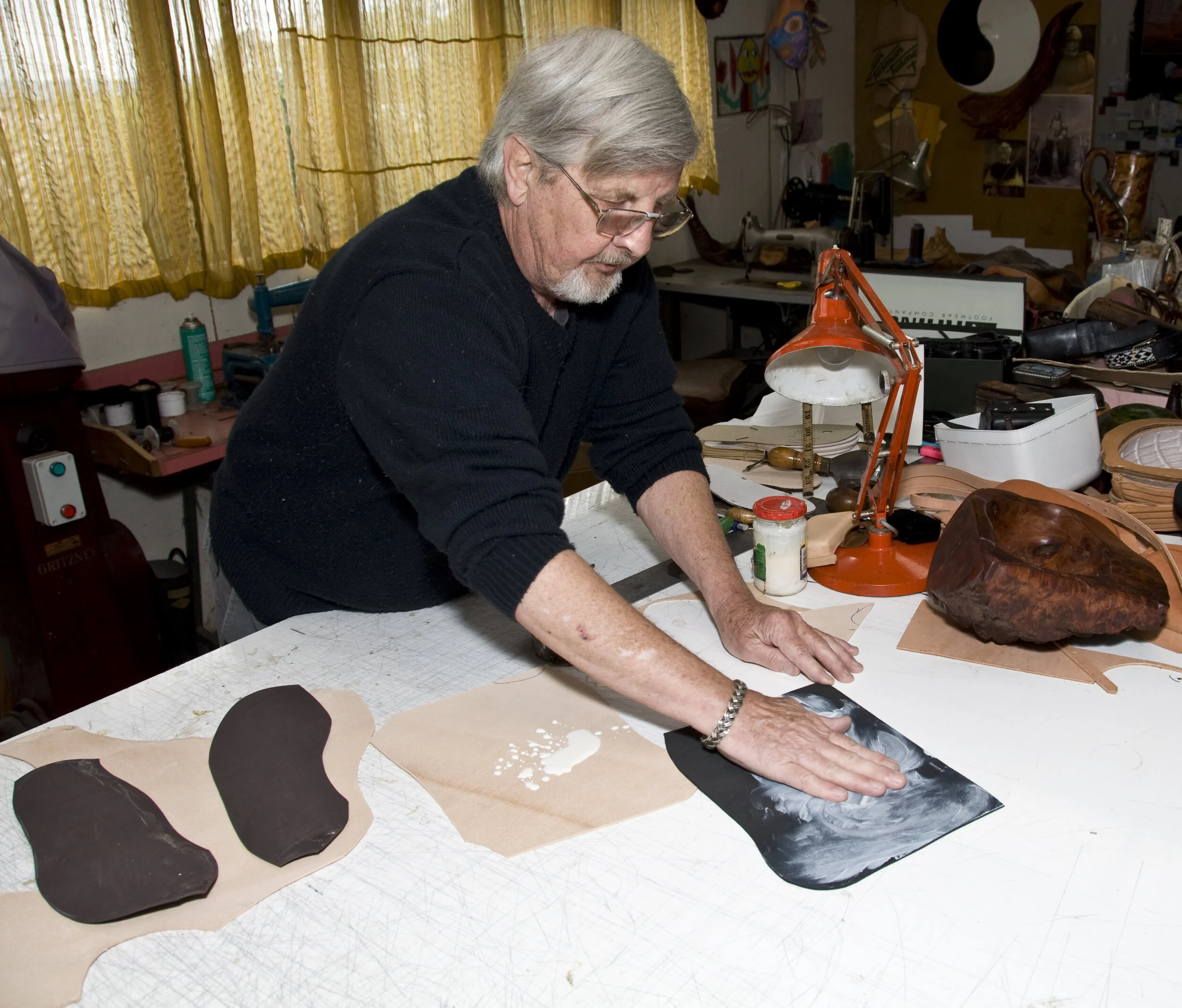 Applying latex to rubber runner and the leather sole