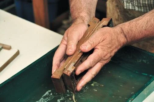 Flattening stones by rubbing together