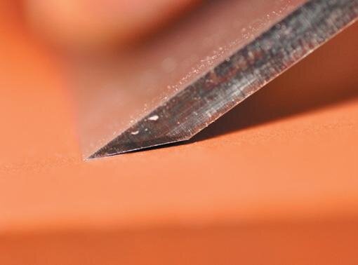 Back of the blade lifted slightly. Ready to hone the microbevel