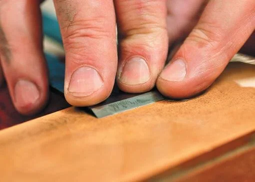 Bending back the burr by flatting off the back on the fine stone