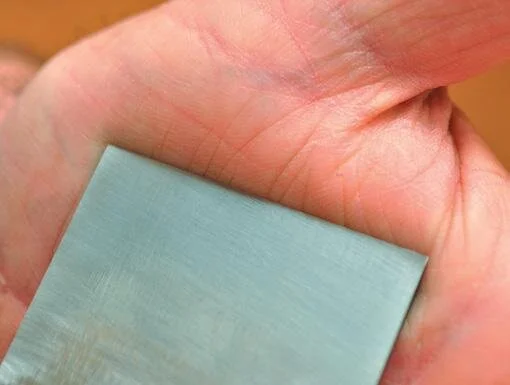 Final removal of the burr by drawing blade downwards