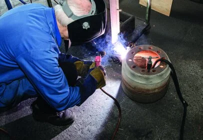Welding the chimney to the brazier