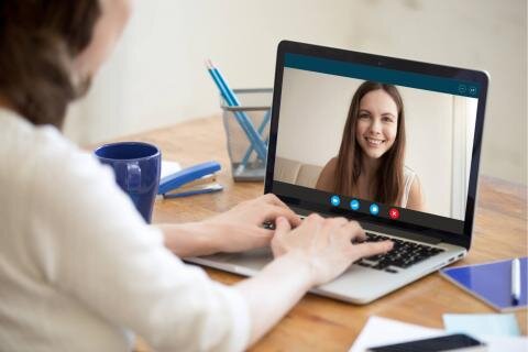 Virtual nanny interview tips graphic showing professional candidate preparing for Zoom or online interview