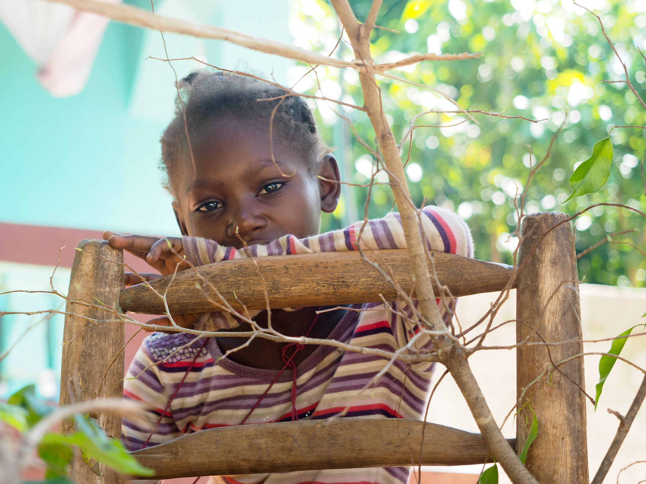 Little girl outside her home, Cite Soleil