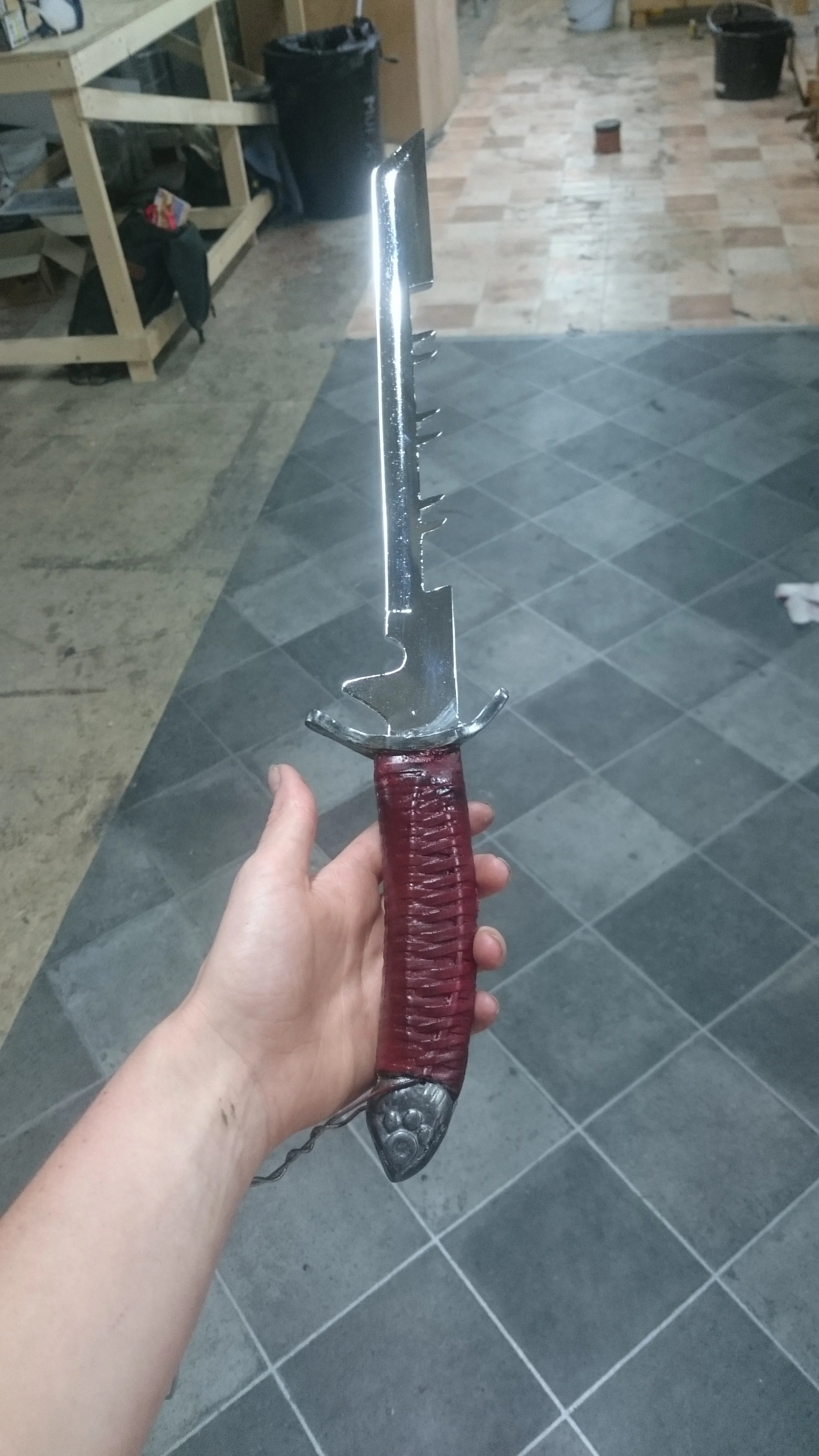  A WIP shot of one of Cormac’s rubber stunt daggers just before the guard and pommel were painted gold. Chrome and paint work by me. 