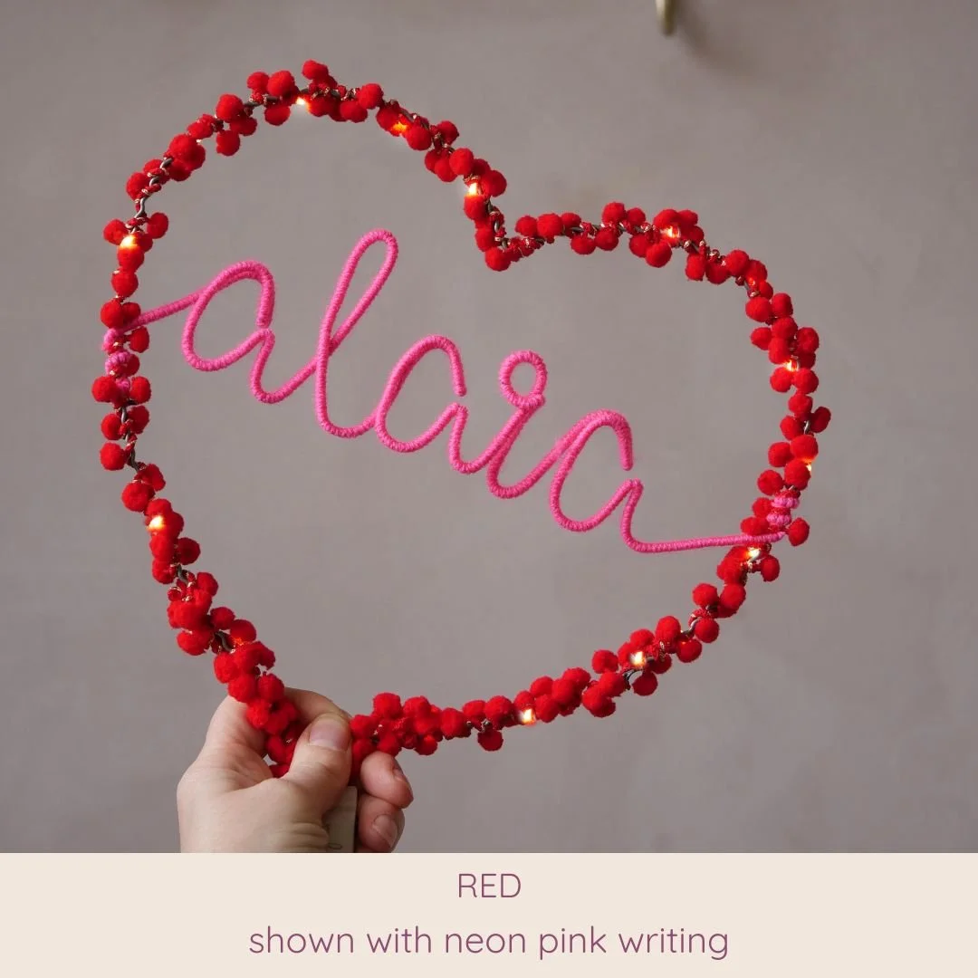 Red personalised heart light with Alaia name in neon pink
