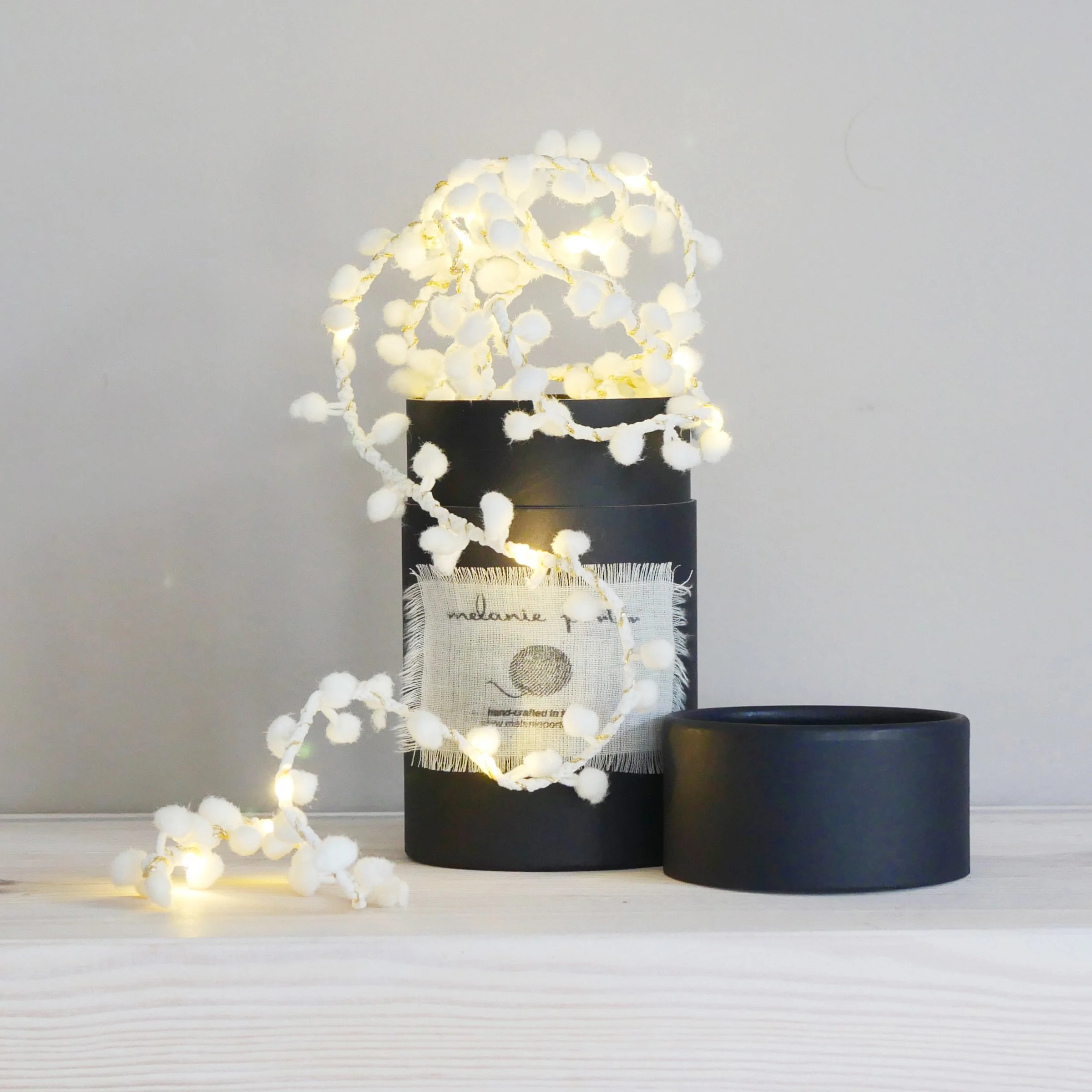 Soft white pom pom fairy light string