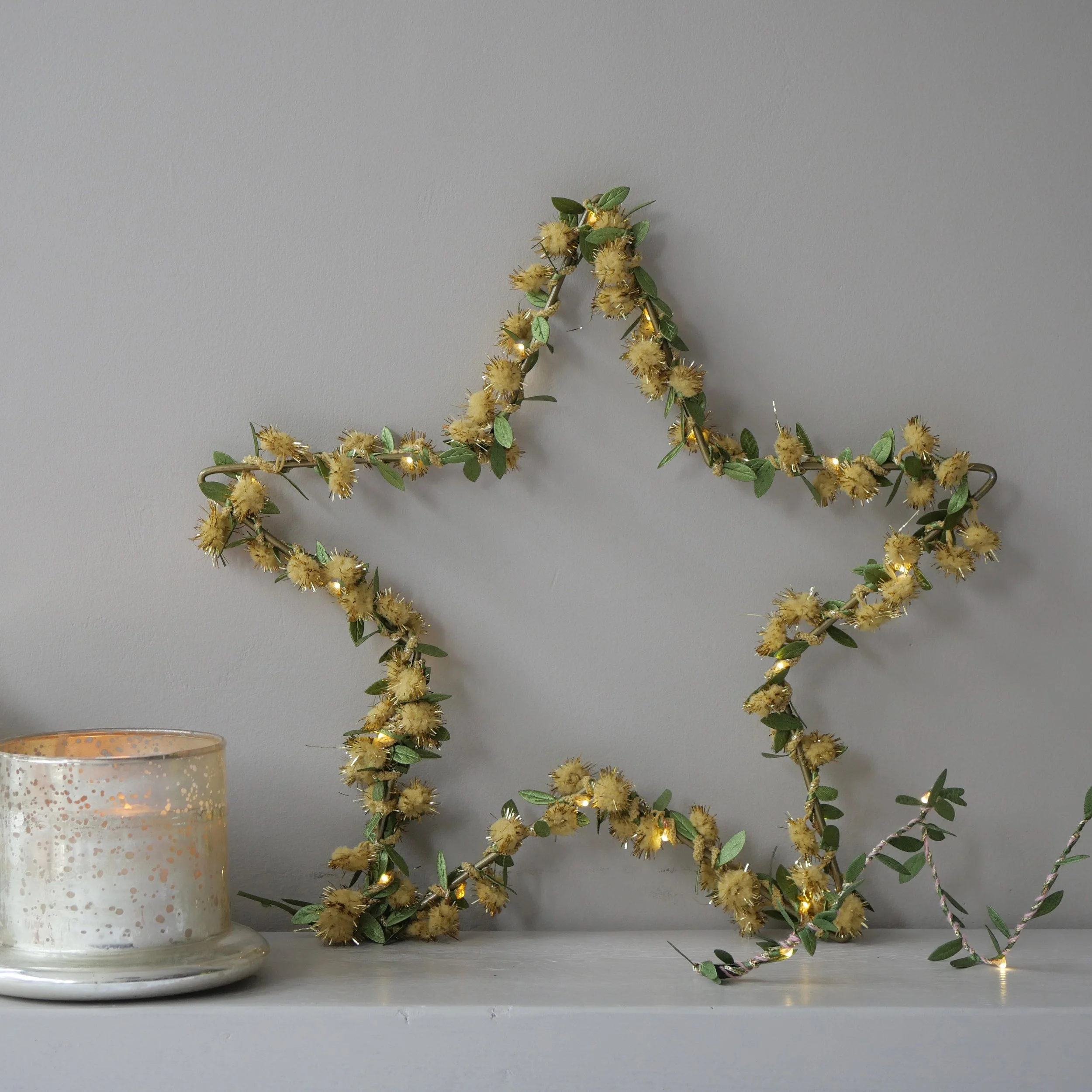 Gold tinsel pom pom and green leaf star.jpg