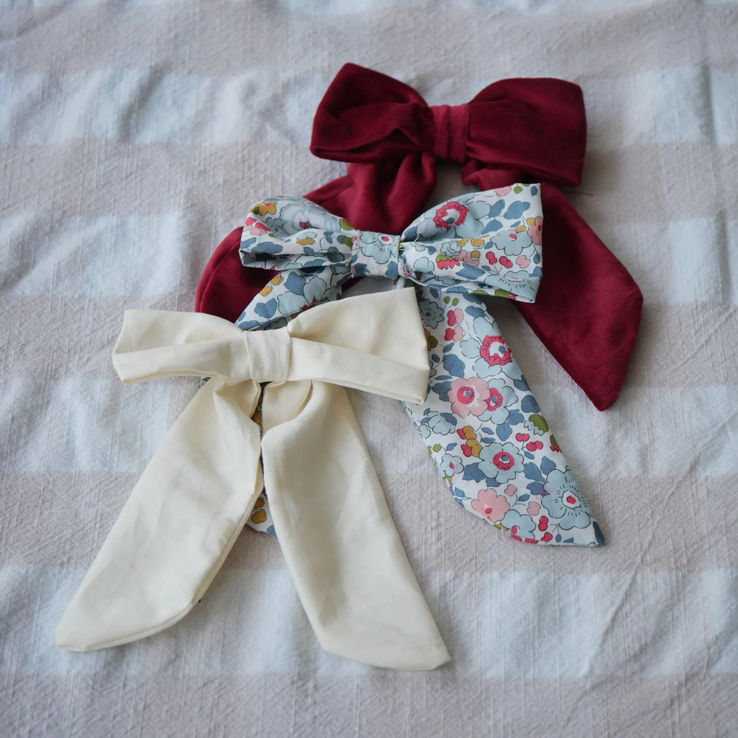 Handmade fairy light battery pack bows in cream, Liberty floral and red velvet