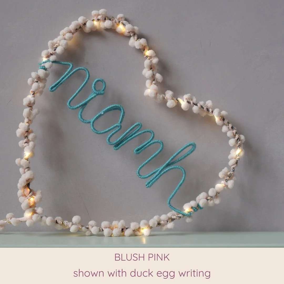 Blush pink personalised heart light with Niamh name in duck egg