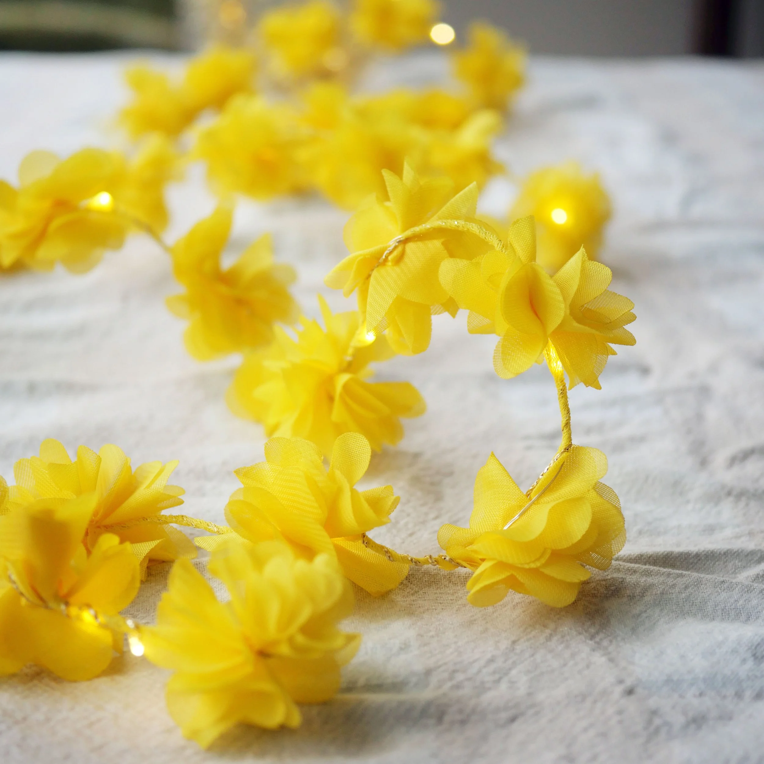 Yellow marigold-inspired flower fairy lights with warm LED lights