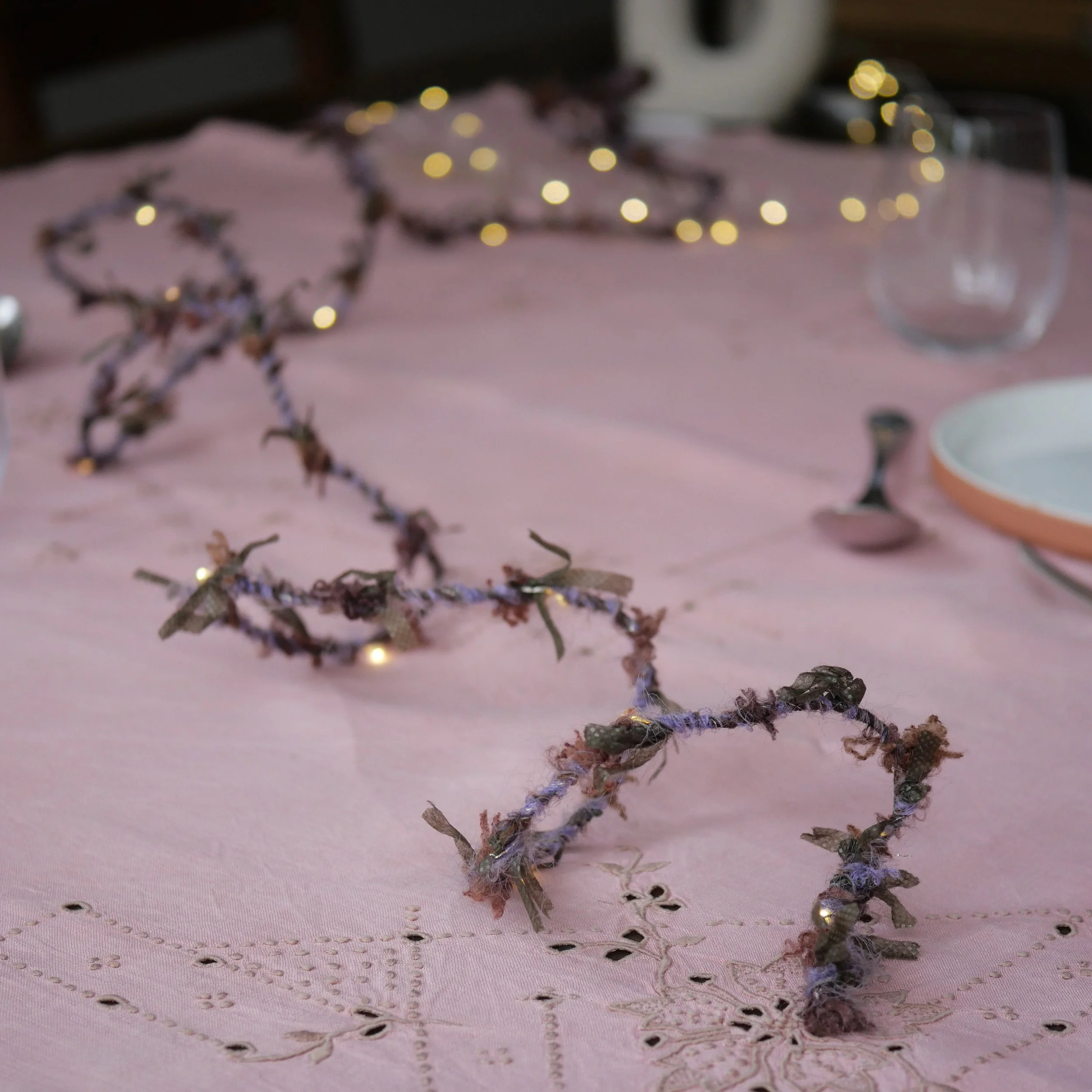 Berry Hedgerow Fairy Lights glowing with warm white LEDs on a styled table