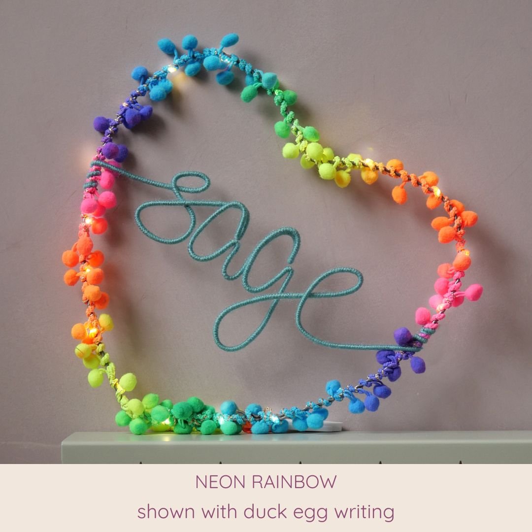 Neon rainbow personalised heart light with Sage name in duck egg
