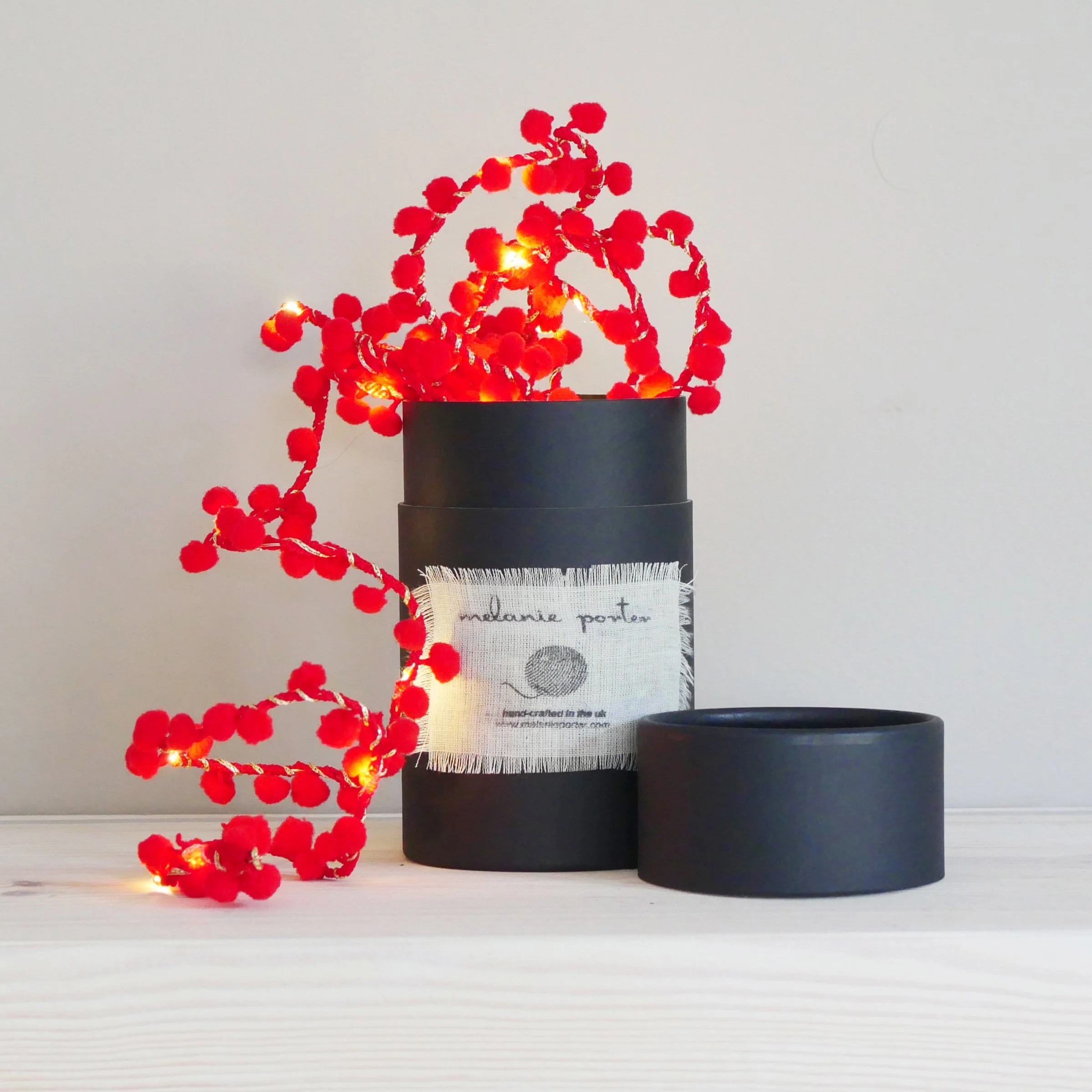 Red pom pom Christmas fairy lights handmade in London